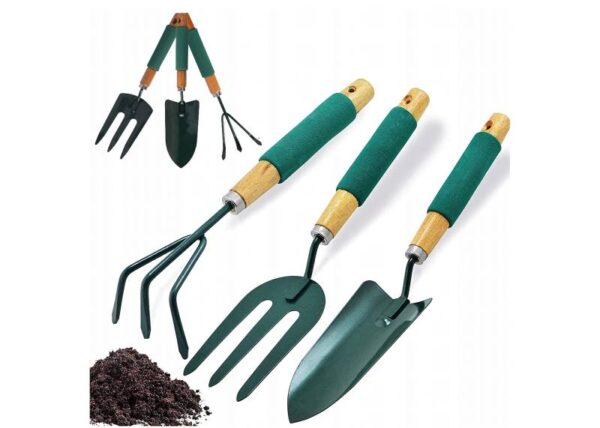 Un ensemble d'outils de jardinage, une pelle, un râteau et une fourchette